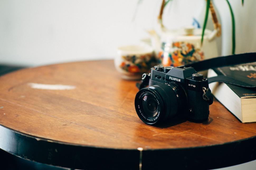 Free Image of Camera on Wooden Table 