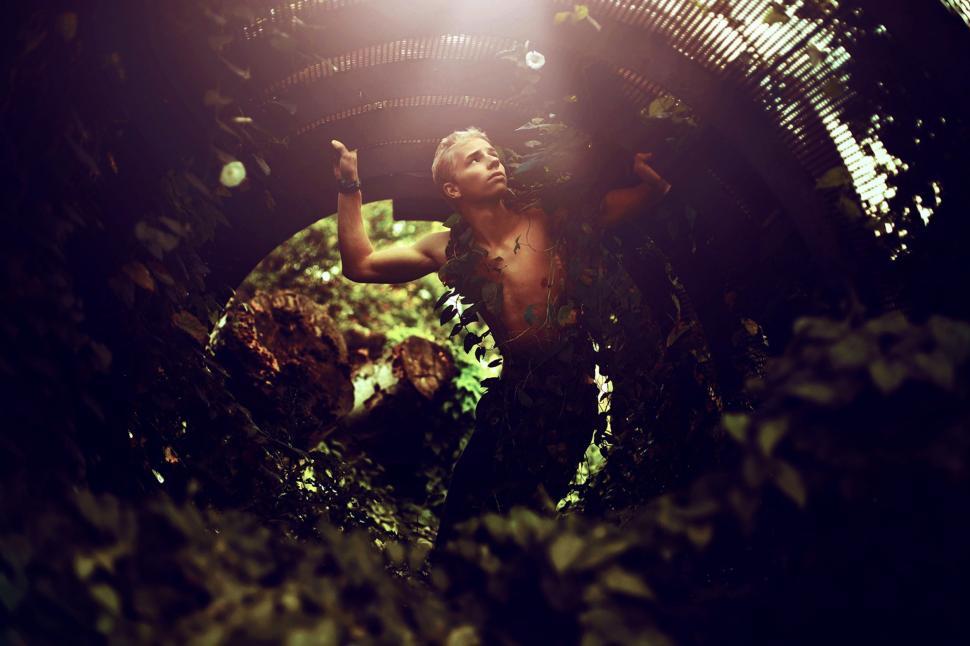 Free Image of Man Standing in the Middle of a Tunnel 