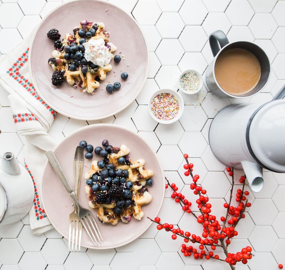 Free Image of Two Plates of Waffles With Berries and Whipped Cream 