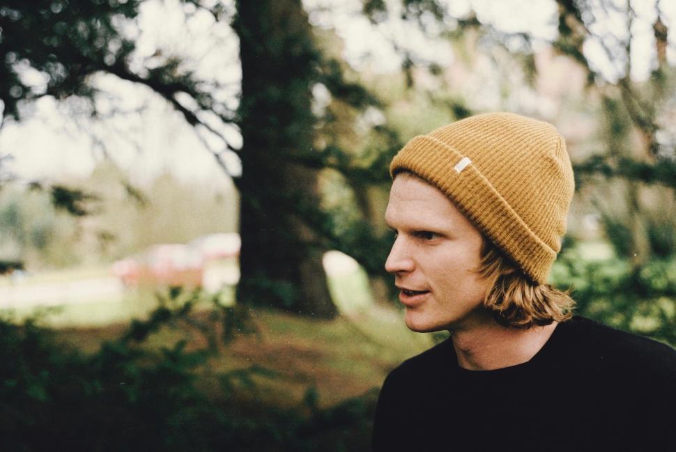Free Image of Man in Beanie Standing in Forest 