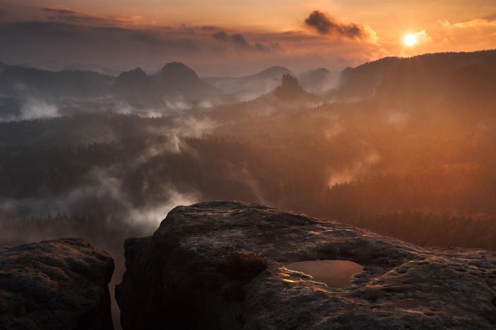 Free Image of Sun Setting Over Mountain Range 