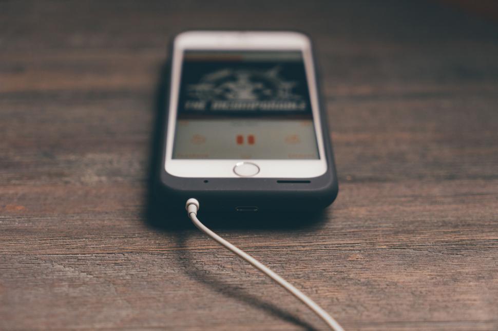 Free Image of Cell Phone Charging on Table 
