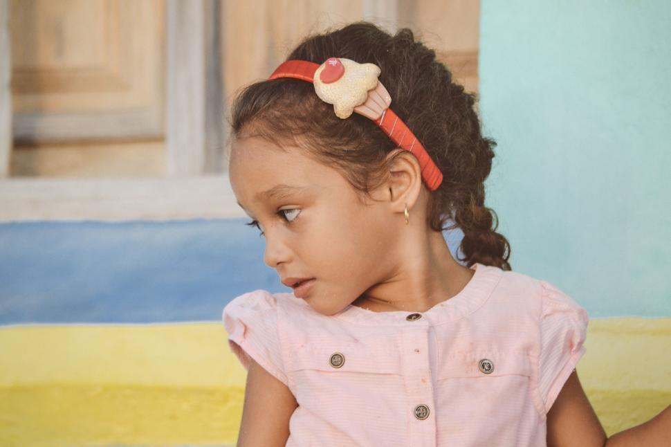 Free Image of Painting of a Little Girl With a Bow in Her Hair 