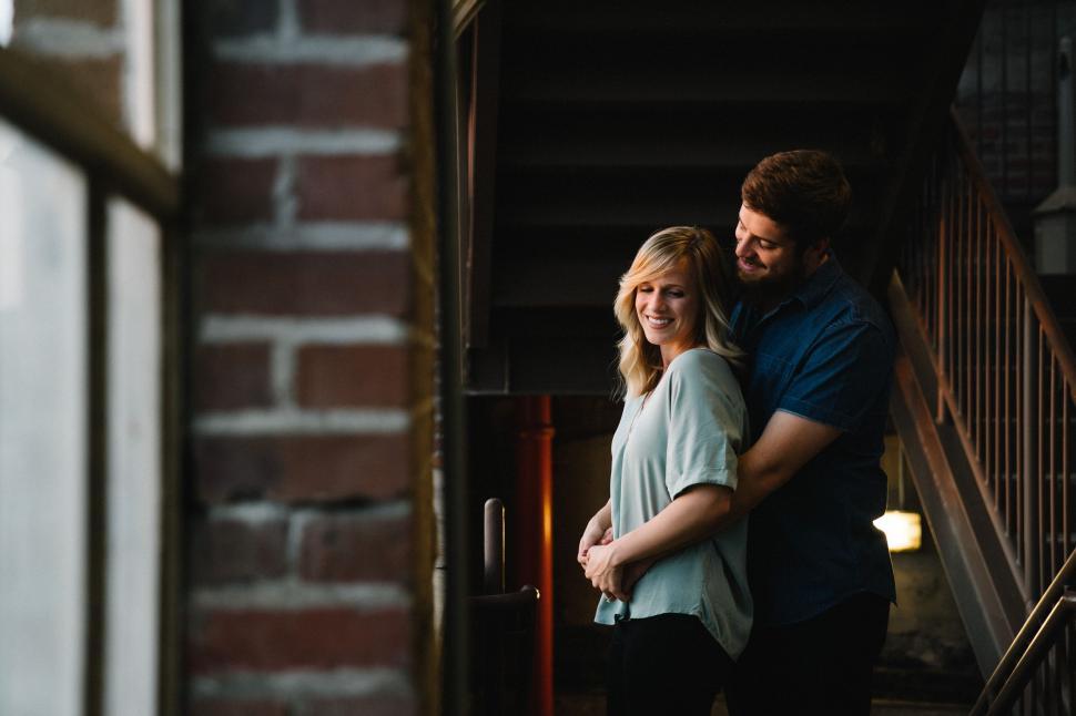 Free Image of Man and Woman Standing in a Doorway 
