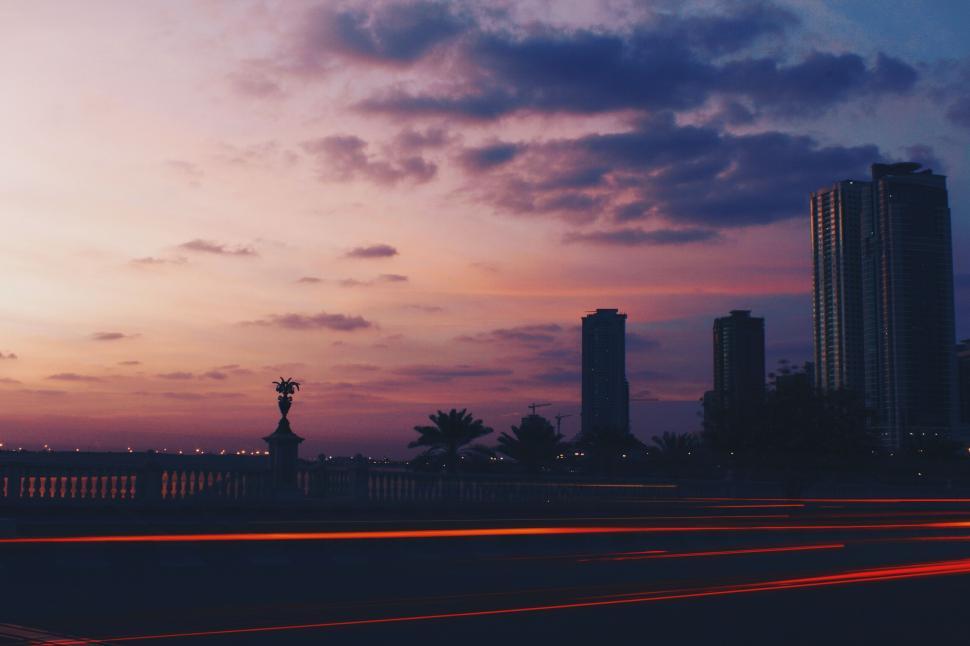 Free Image of City Skyline With Distant Clock Tower 