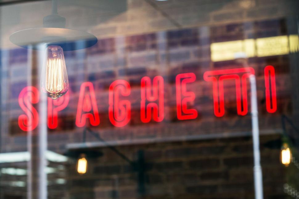Free Image of Red Sign on Side of Building 