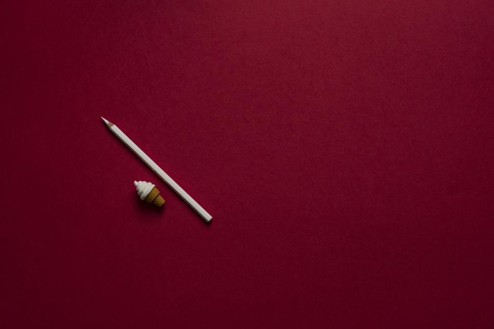 Free Image of Red Background With White Toothbrush and Toothpaste 